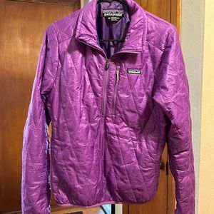 Women’s Patagonia purple half zip pullover size medium.